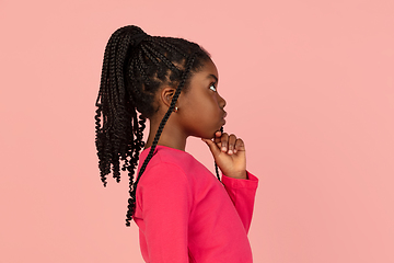 Image showing Handsome african little girl portrait isolated on pink studio background with copyspace