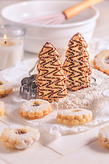 Image showing Christmas gingerbread and cookies with baking ingredients in whi