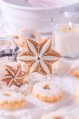 Image showing Christmas gingerbread and cookies with baking ingredients in white