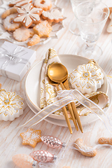 Image showing Place setting and Christmas table decorated with ornaments, ging