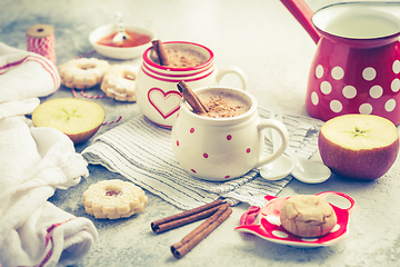 Image showing Winter hot drink. Hot chocolate or cocoa with spices, cookies and fresh apple