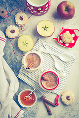 Image showing Winter hot drink. Hot chocolate or cocoa with spices, cookies and fresh apple