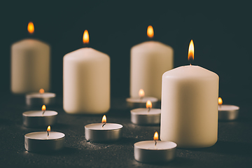 Image showing Candle flames glowing in the dark, spiritual atmosphere, religion and Christmas