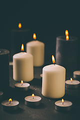 Image showing Candle flames glowing in the dark, spiritual atmosphere, religion and Christmas