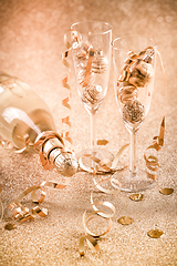 Image showing New years eve celebration background with champagne, glasses and ornaments