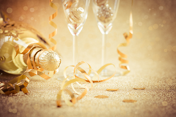 Image showing New years eve celebration background with champagne, glasses and ornaments