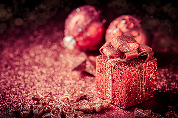 Image showing Christmas glitter ornaments and present box 