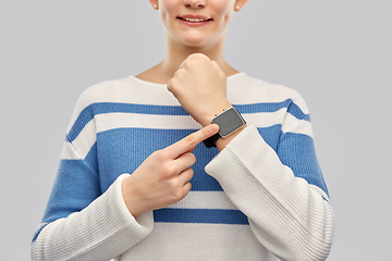 Image showing happy smiling teenage girl with smart watch