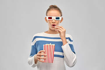 Image showing teenage girl in 3d movie glasses eating popcorn