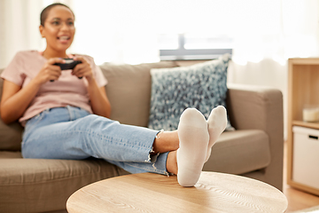 Image showing african american woman with gamepad playing game