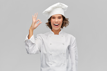 Image showing happy smiling female chef showing ok hand sign