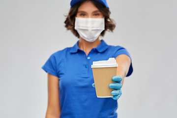 Image showing saleswoman in face mask with takeaway coffee cup