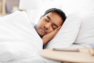 Image showing indian man sleeping in bed at home