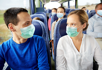 Image showing couple of passengers in medical mask in travel bus