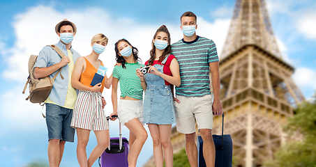 Image showing friends in masks with travel bags at eiffel tower