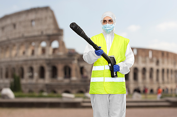 Image showing sanitation worker in hazmat with pressure washer