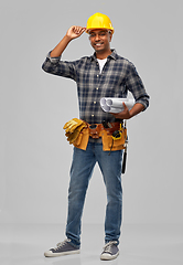 Image showing happy indian builder in helmet with blueprint