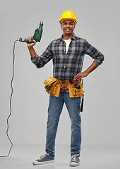 Image showing happy indian builder in helmet with electric drill