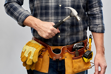 Image showing male builder with hammer and working tools on belt