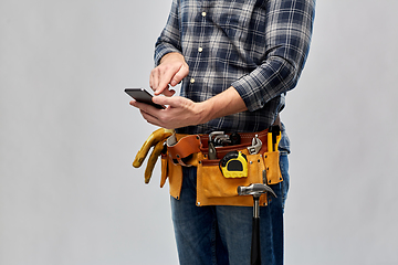 Image showing worker or builder with phone and working tools