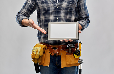 Image showing male builder with working tools showing tablet pc