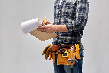 Image showing builder with clipboard, pencil and working tools