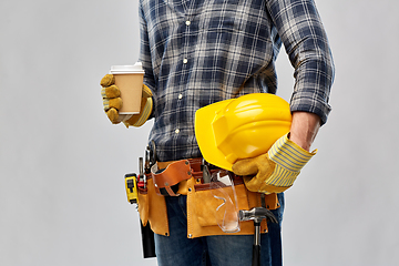 Image showing male builder with coffee, helmet and working tools