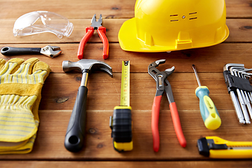 Image showing different work tools on wooden boards