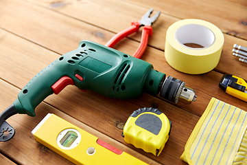 Image showing different work tools on wooden boards