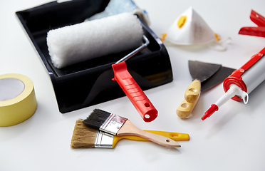 Image showing different painting work tools on white background