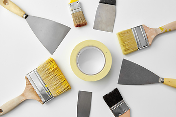 Image showing different size paint brushes and putty knives