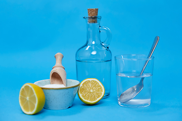 Image showing lemons, washing soda, bottle of vinegar and glass