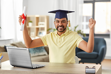 Image showing indian student with laptop and diploma at home