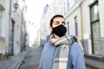 Image showing woman wearing protective reusable mask in city