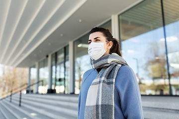 Image showing woman wearing protective medical mask in city