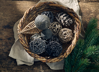 Image showing Christmas decorations in a wicker basket