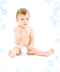 Image showing baby boy in diaper with toothbrush