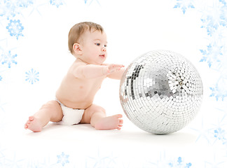 Image showing adorable baby boy with big disco ball