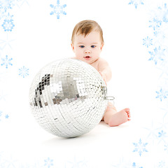 Image showing adorable baby boy with big disco ball