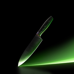 Image showing Chef s knife isolated on black studio background with green neon path and copyspace