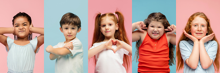 Image showing Young and happy kids gesturing isolated on multicolored studio background. Human emotions, facial expression concept