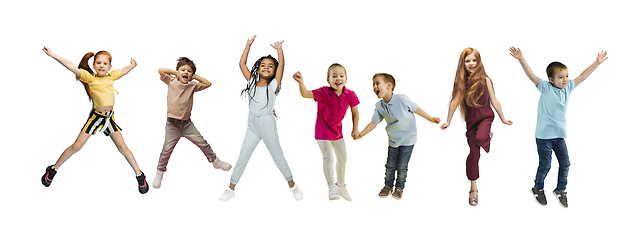 Image showing Little and happy kids gesturing isolated on white studio background. Human emotions, facial expression concept