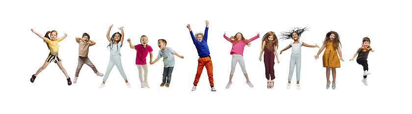 Image showing Little and happy kids gesturing isolated on white studio background. Human emotions, facial expression concept