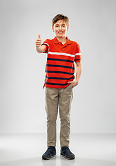 Image showing happy boy in red polo t-shirt showing thumbs up