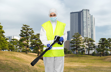 Image showing sanitation worker in hazmat with pressure washer