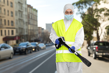 Image showing sanitation worker in hazmat with pressure washer