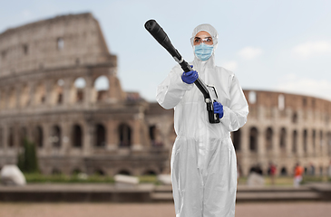 Image showing sanitation worker in hazmat with pressure washer