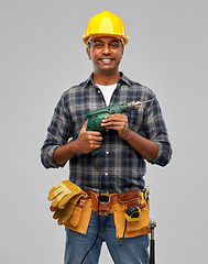 Image showing happy indian builder in helmet with electric drill