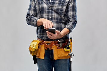 Image showing worker or builder with phone and working tools
