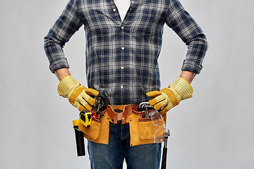 Image showing builder with working tools, goggles and gloves on